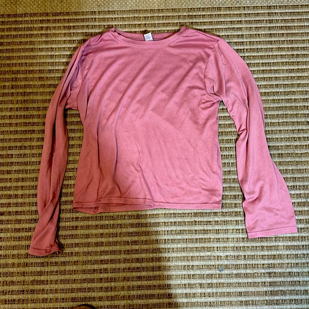 A women’s pink undershirt in the size large